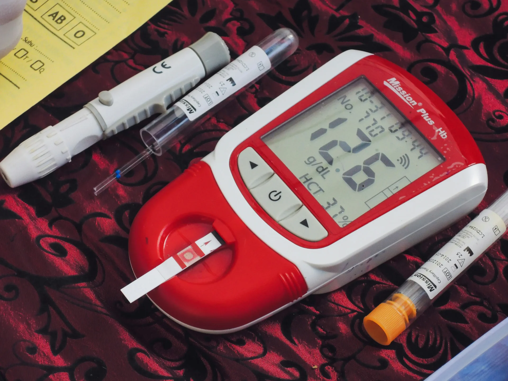 Medical testing devices including glucose testing and blood samples.